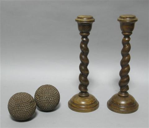 Appraisal: PAIR OF SPIRAL TURNED CANDLESTICKS Together with ball ornaments -