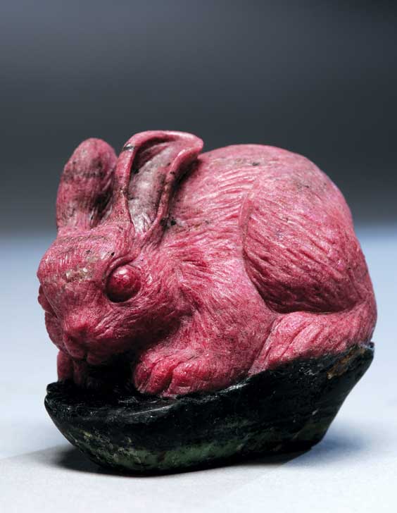 Appraisal: CARVED RUBY-IN-ZOISITE RABBIT Well rendered ruby-in-zoisite model of a rabbit