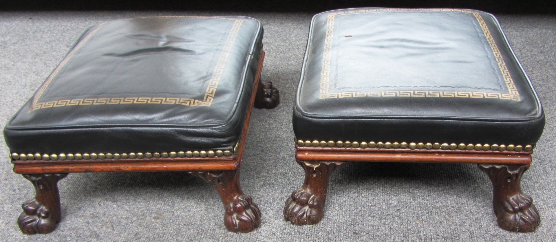 Appraisal: A pair of Regency design small rosewood footstools on lions