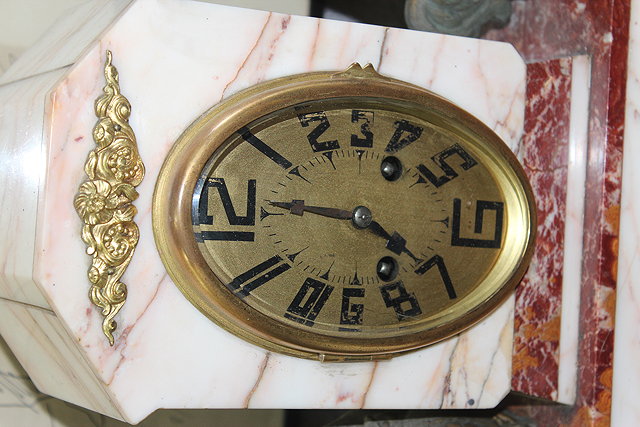 Appraisal: AN ART DECO MARBLE MANTEL CLOCK the central oval gilt