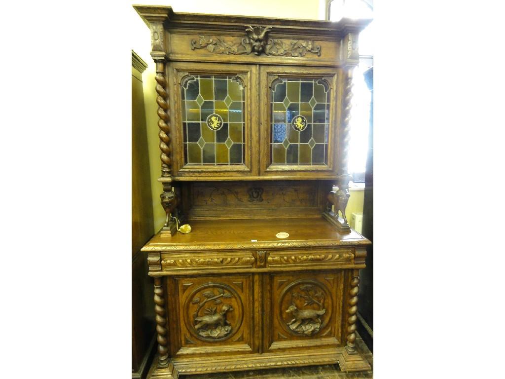 Appraisal: A Victorian oak buffet the recessed upper section enclosed by