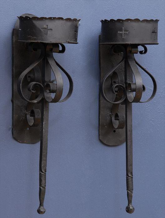 Appraisal: PAIR OF MEDIEVAL-STYLE WROUGHT IRON WALL LIGHTS in