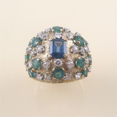 Appraisal: A gem set cocktail ring of bombe form set with