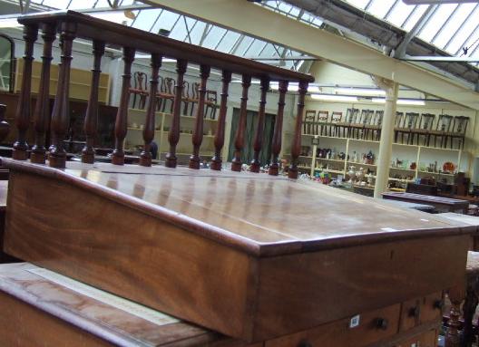 Appraisal: A th century mahogany clerks writing slope with baluster turned