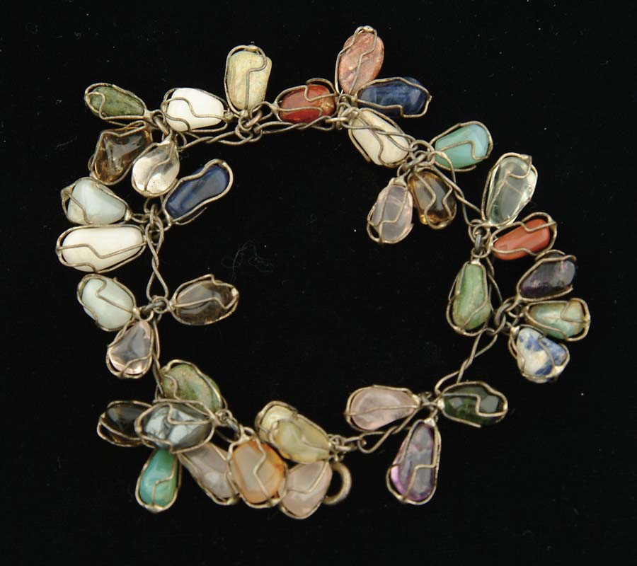 Appraisal: MULTI-STONE AND SILVER WIRE BRACELET Wire bracelet has twelve clusters