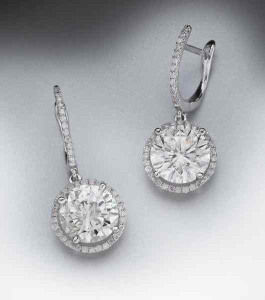 Appraisal: K gold and diamond drop earringsfeaturing a pair of round