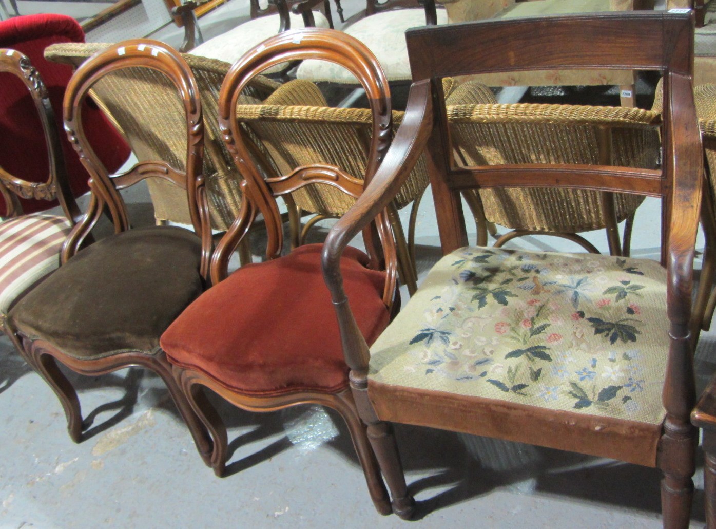 Appraisal: A mahogany armchair together with a pair of balloon back