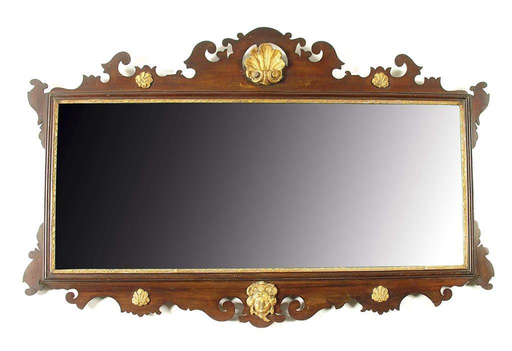 Appraisal: A mahogany and giltwood fret-frame landscape wall mirror