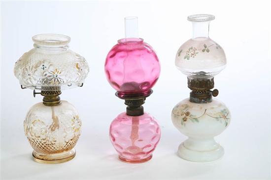 Appraisal: THREE MINIATURE LAMPS By Plume Atwood Clear glass with embossed