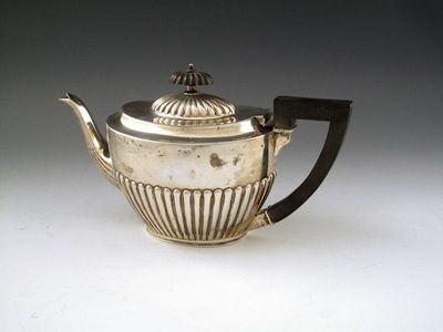 Appraisal: A Victorian silver teapot by Martin and Hall London oval