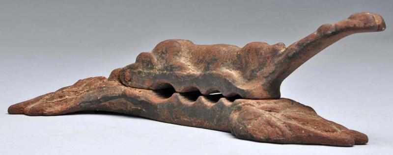 Appraisal: Cast Iron Sleeping Dog Cork Press Description Circa to Decorative