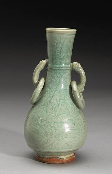 Appraisal: A Zhejiang celadon pear-form vase Ming Dynasty Its tall neck