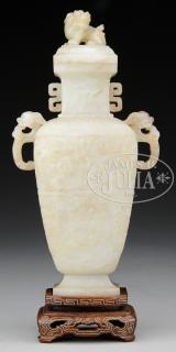 Appraisal: CARVED JADE COVERED VASE th century China Vase made in