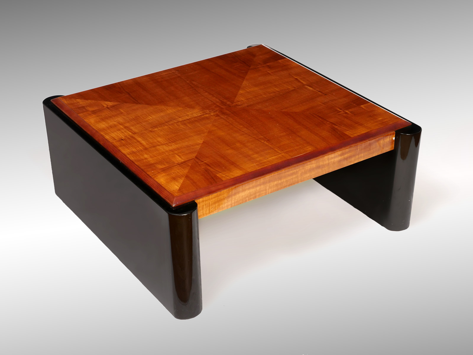 Appraisal: HENREDON COFFEE TABLE Modern tiger oak top mounted on black