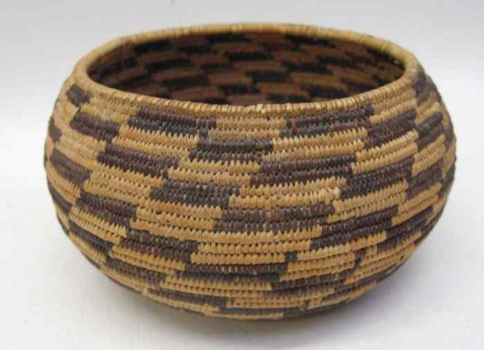 Appraisal: POMO INDIAN BASKET sturdily woven with dark brown design alternating