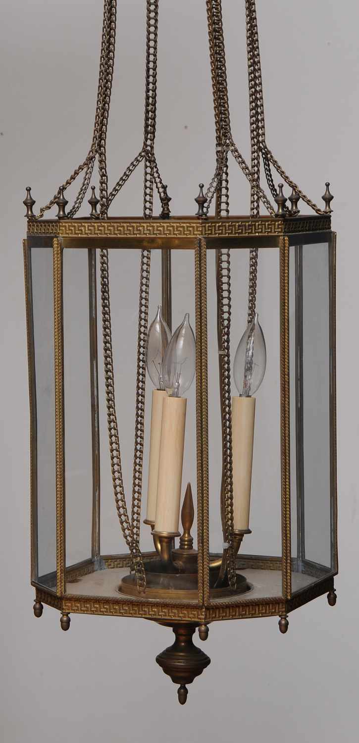 Appraisal: DIRECTOIRE GILT-METAL OCTAGONAL THREE-LIGHT LANTERN The mechanical corona joined by