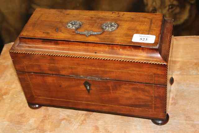 Appraisal: A TH CENTURY MAHOGANY TEA CADDY with shaped top and