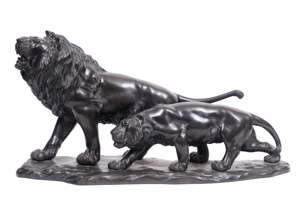 Appraisal: JAPANESE BRONZE PROWLING MALE FEMALE LIONSJapanese patinated bronze prowling male