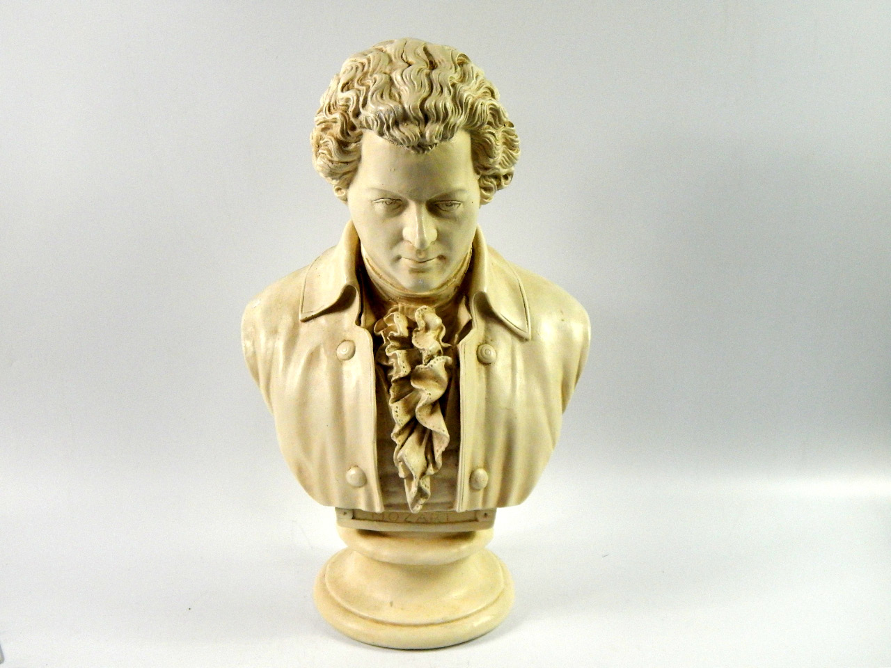 Appraisal: A plaster bust modelled as Mozart cm high