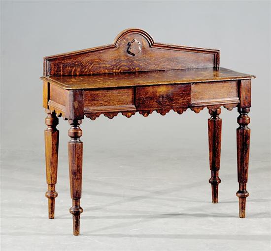 Appraisal: Regency carved oak console table th century shaped backsplash above