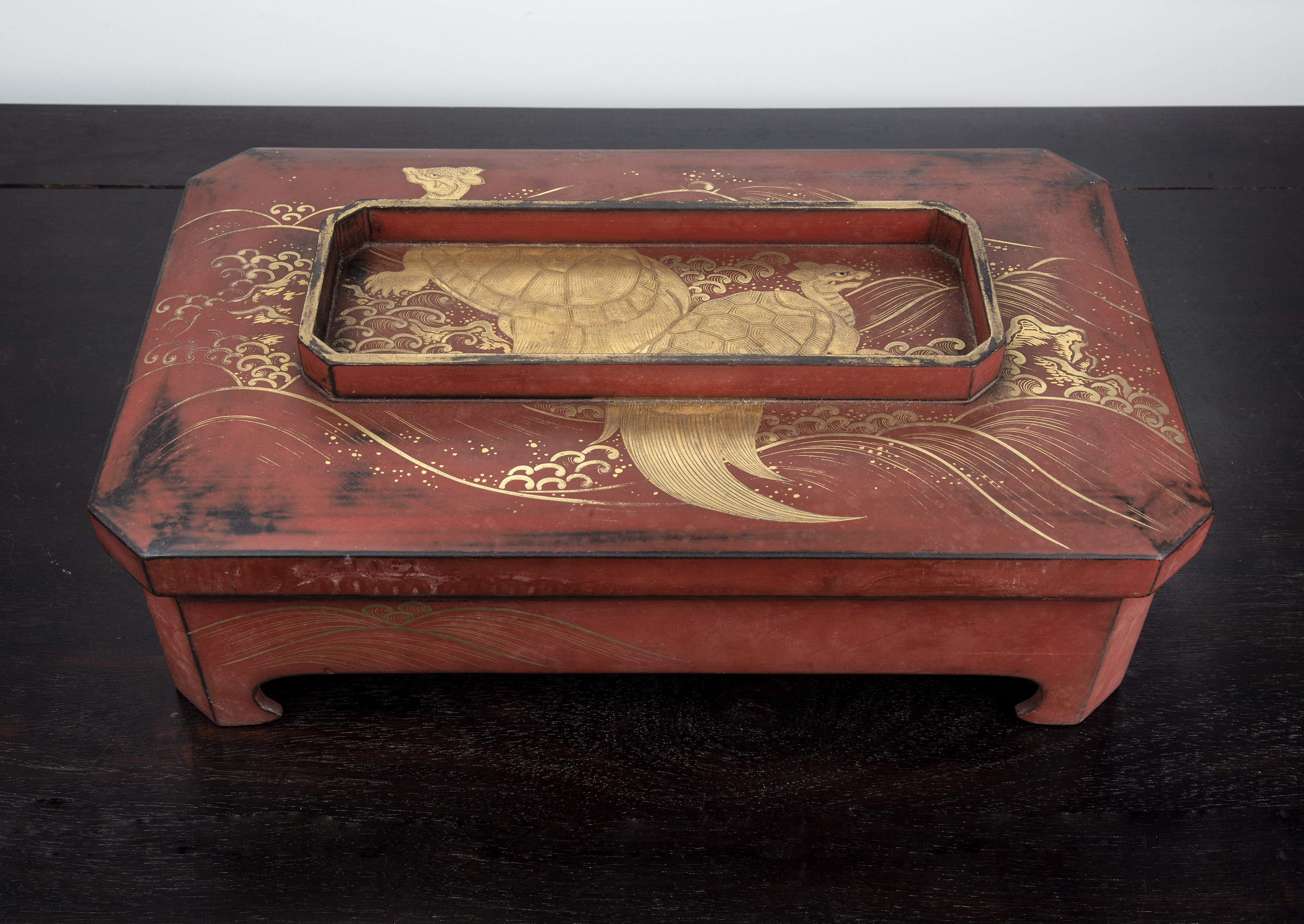 Appraisal: Red and gold lacquer ogameJapanese Meiji period with waves and