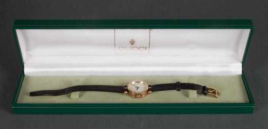 Appraisal: Gucci gilt metal and enamel lady's watch with a Gucci