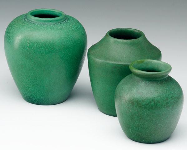 Appraisal: TECO Three vases covered in smooth matte green glaze All