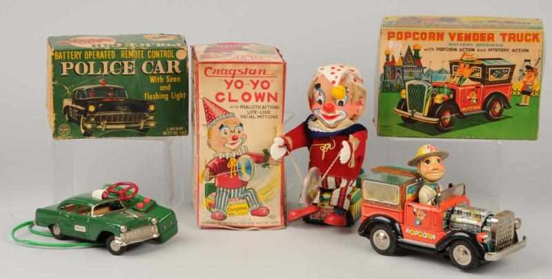 Appraisal: Lot of Battery-Operated Toys Description Japanese Working Includes Popcorn Vendor