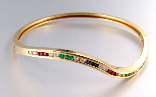 Appraisal: K SAPPHIRE EMERALD RUBY AND DIAMOND BANGLE BRACELET K yellow