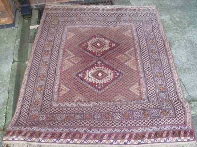 Appraisal: A FLAT WEAVE TRIBAL RUG with allover geometric decoration within