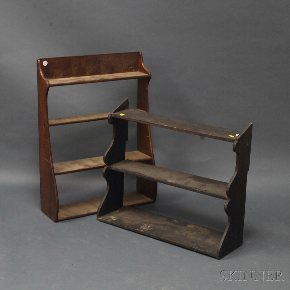 Appraisal: Two Shaped-end Tiered Shelves a four-tier walnut whale-end shelf and