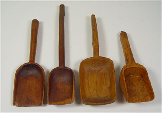 Appraisal: Four Carved Wooden Scoops Shovels Circa Chips cracks and discoloration