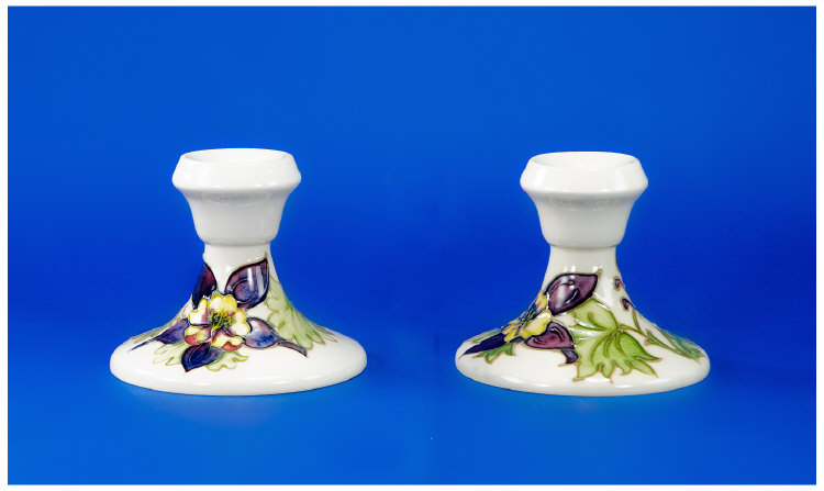 Appraisal: Moorcroft Candlesticks Pair Of Columbine Design Candlesticks On White Ground