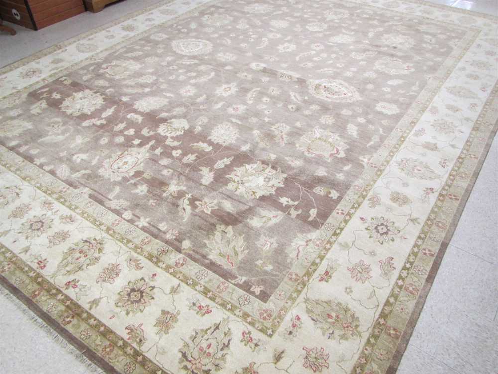 Appraisal: HAND KNOTTED ORIENTAL CARPET Turkish Oushak design of stylized foliage