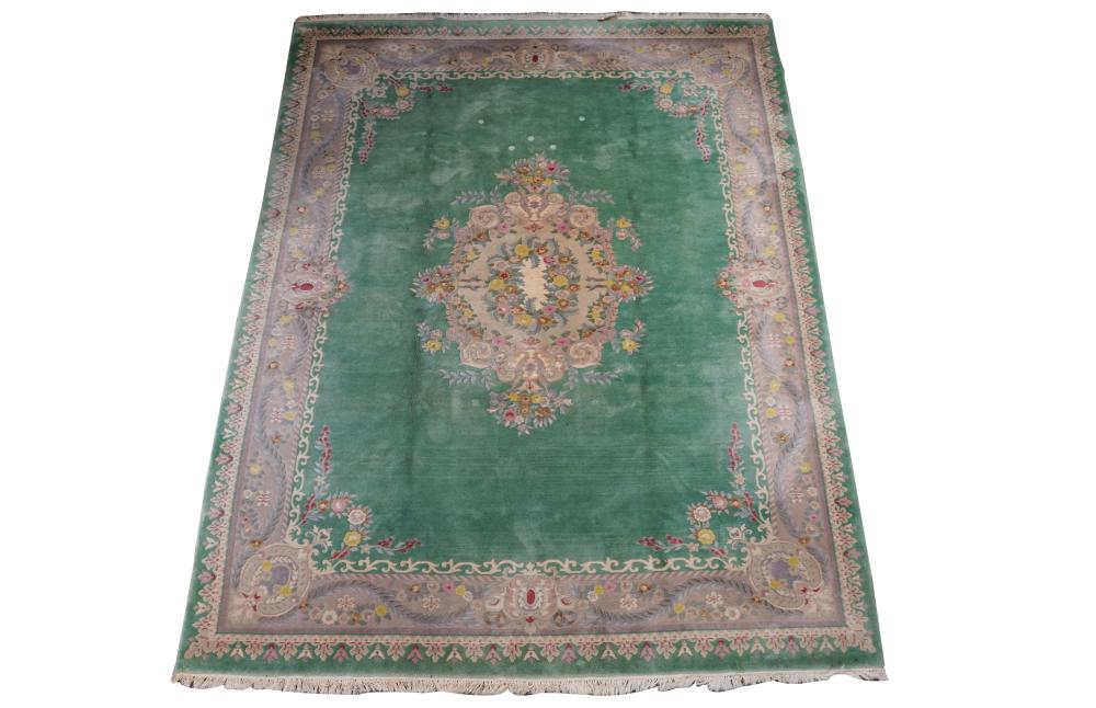 Appraisal: FLORAL WOOL RUGcontemporary green field Condition in need of cleaning