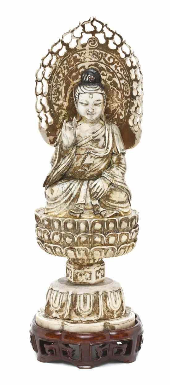 Appraisal: A Chinese Carved Ivory Model of Buddha depicting the seated