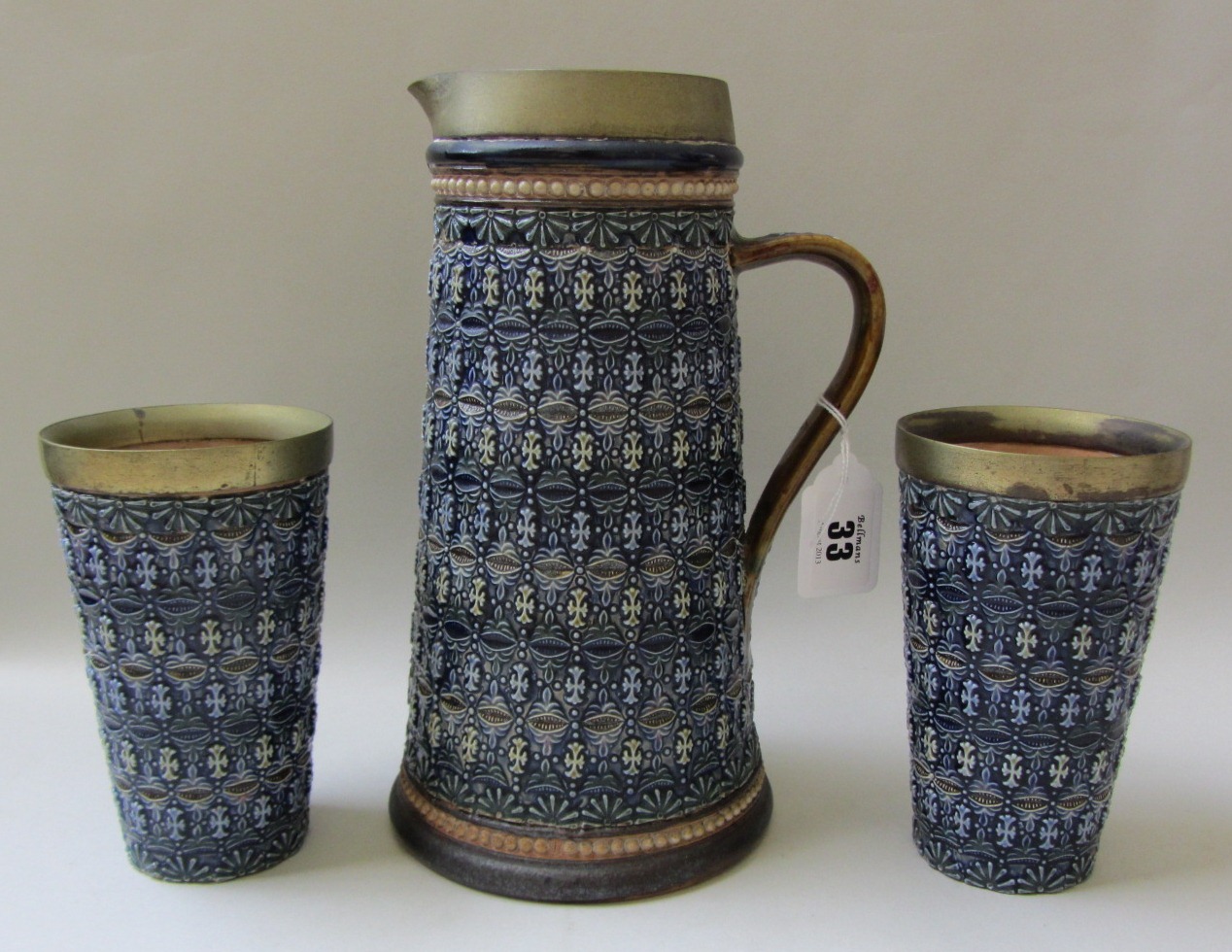 Appraisal: A Doulton Lambeth stoneware lemonade set with gilt metal rims