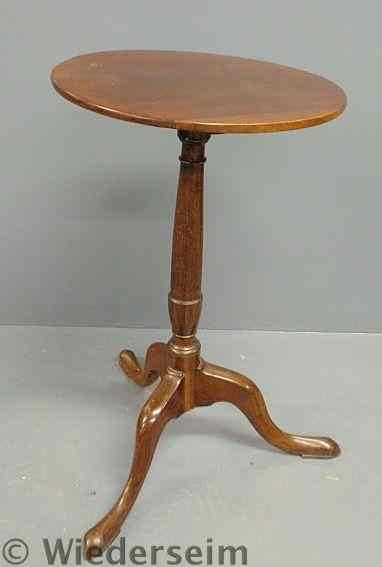 Appraisal: Mahogany candlestand c with an urn-turned shaft and snake feet