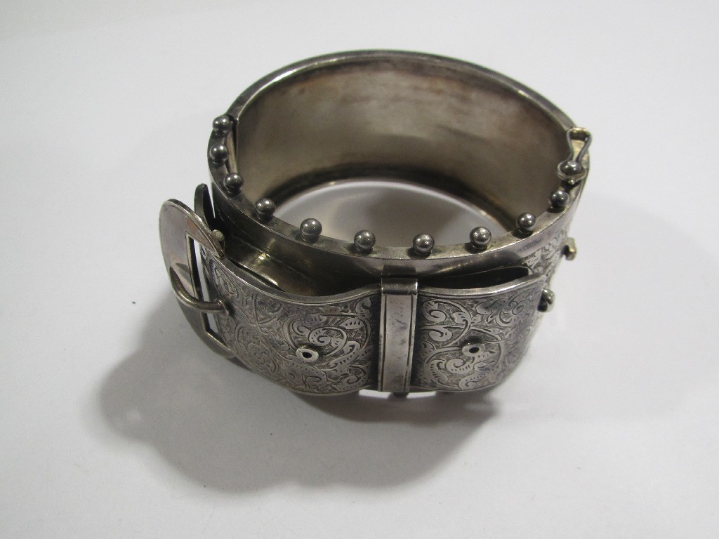 Appraisal: Victorian engraved silver buckle bangle with buckle opening to reveal