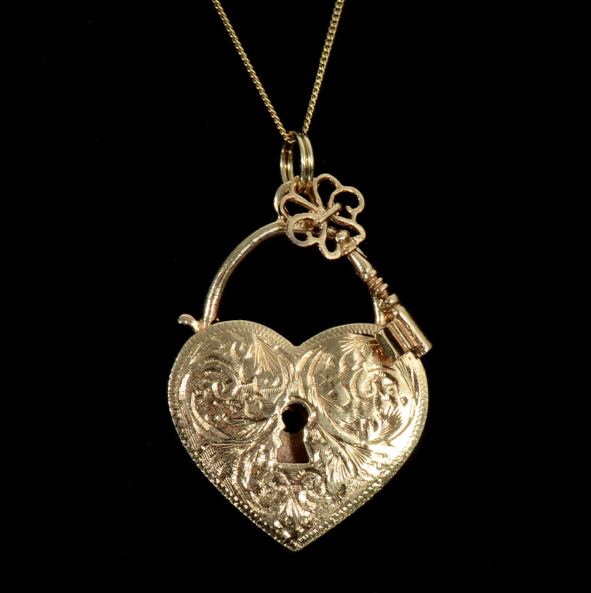 Appraisal: ENGLISH K HEART LOCK PENDANT Engraved heart and key on