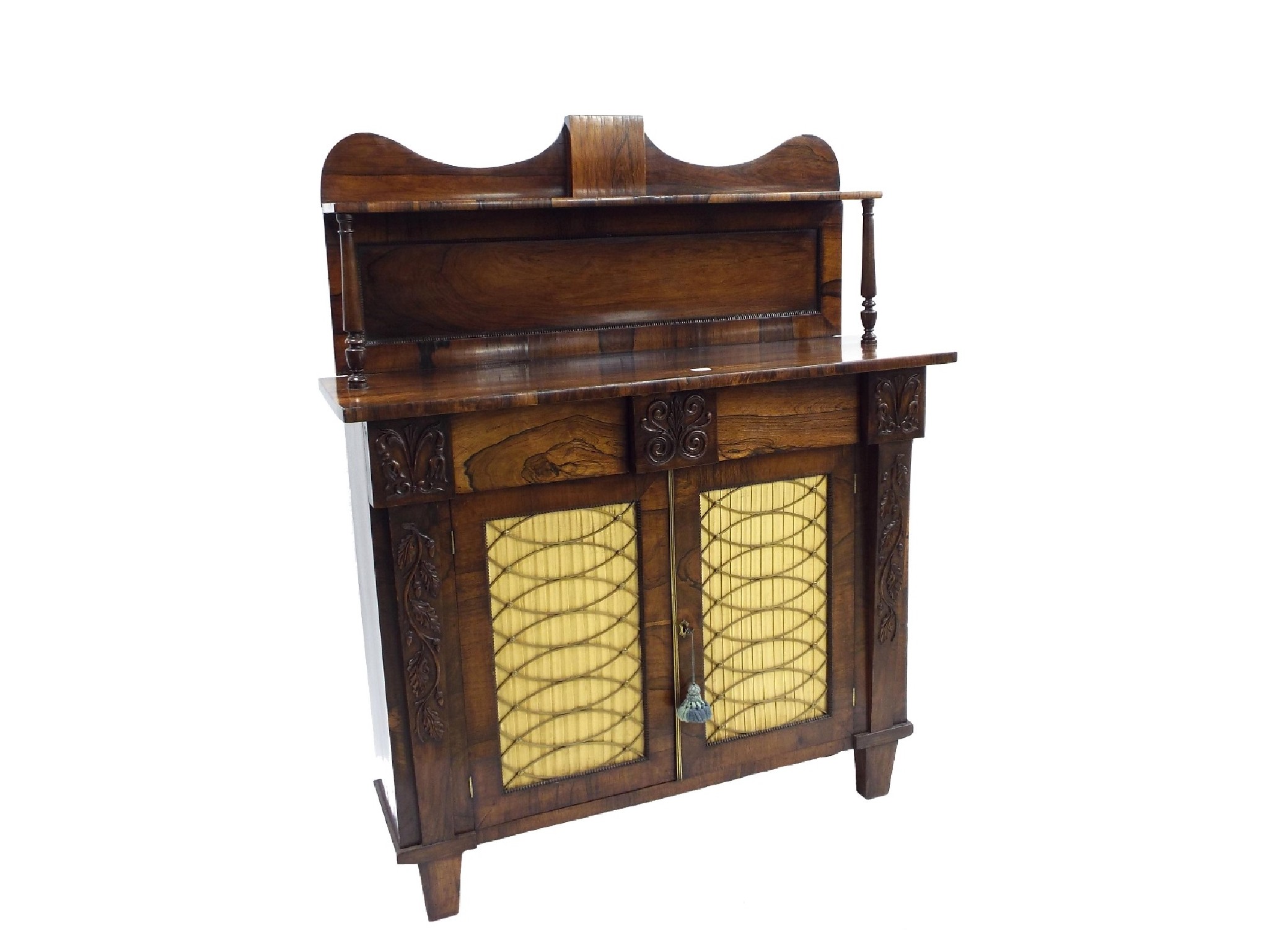 Appraisal: Attractive Regency rosewood chiffonier the raised shelved back upon baluster