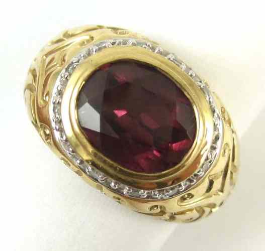 Appraisal: GARNET AND FOURTEEN KARAT GOLD RING The ring weighs grams