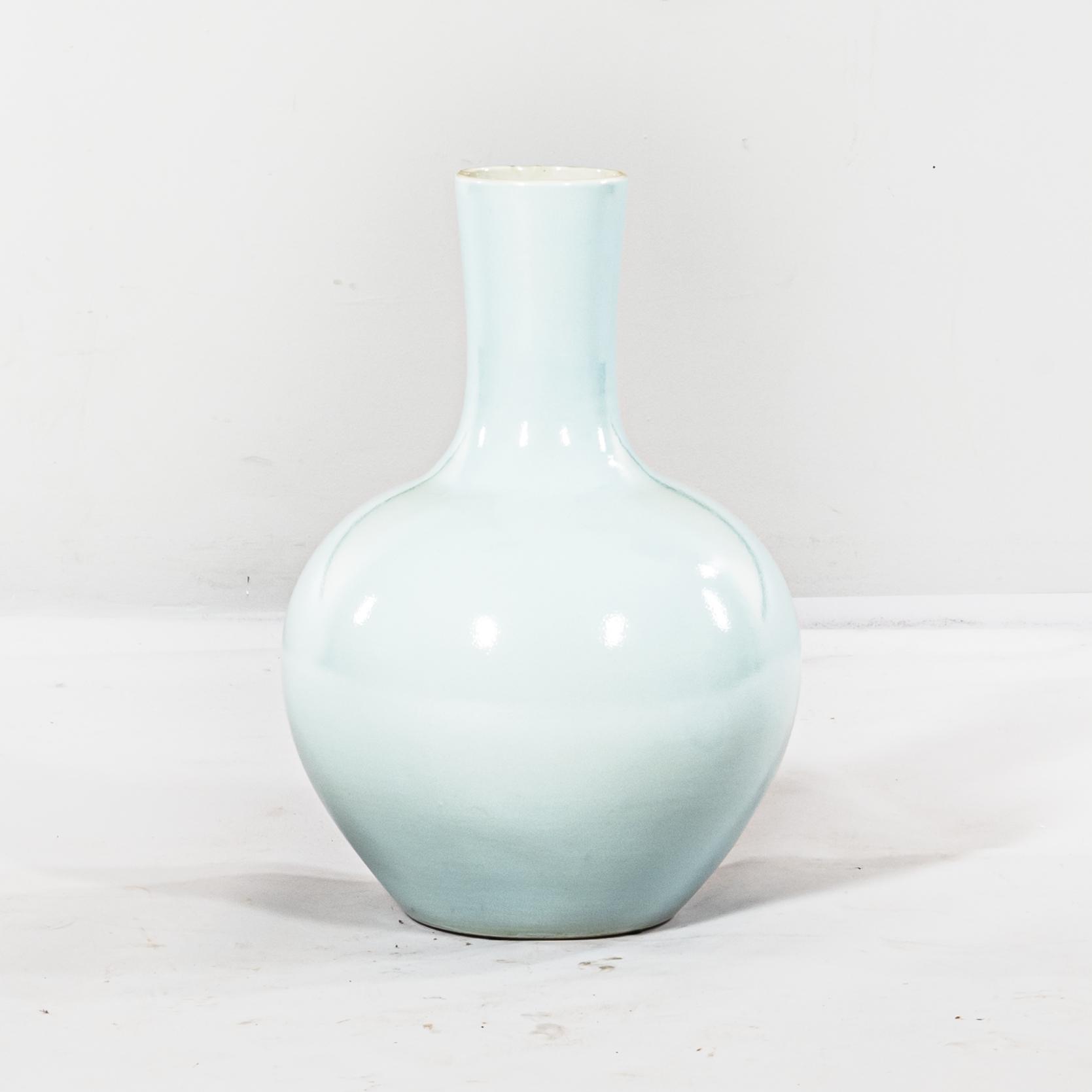 Appraisal: LARGE SKY BLUE-GLAZED BOTTLE VASE China modern tianqiuping -form resting