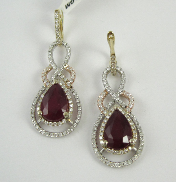 Appraisal: PAIR OF FOURTEEN KARAT GOLD DIAMOND AND RUBY EARRINGS each