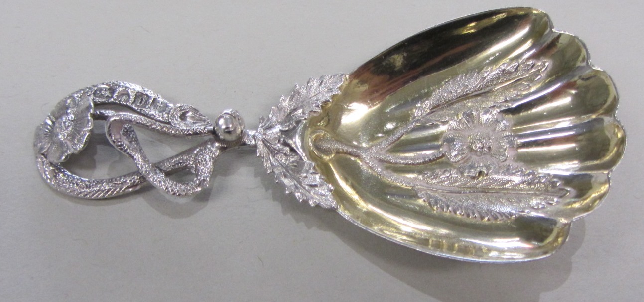 Appraisal: A Victorian silver tea caddy spoon the scalloped fan shaped