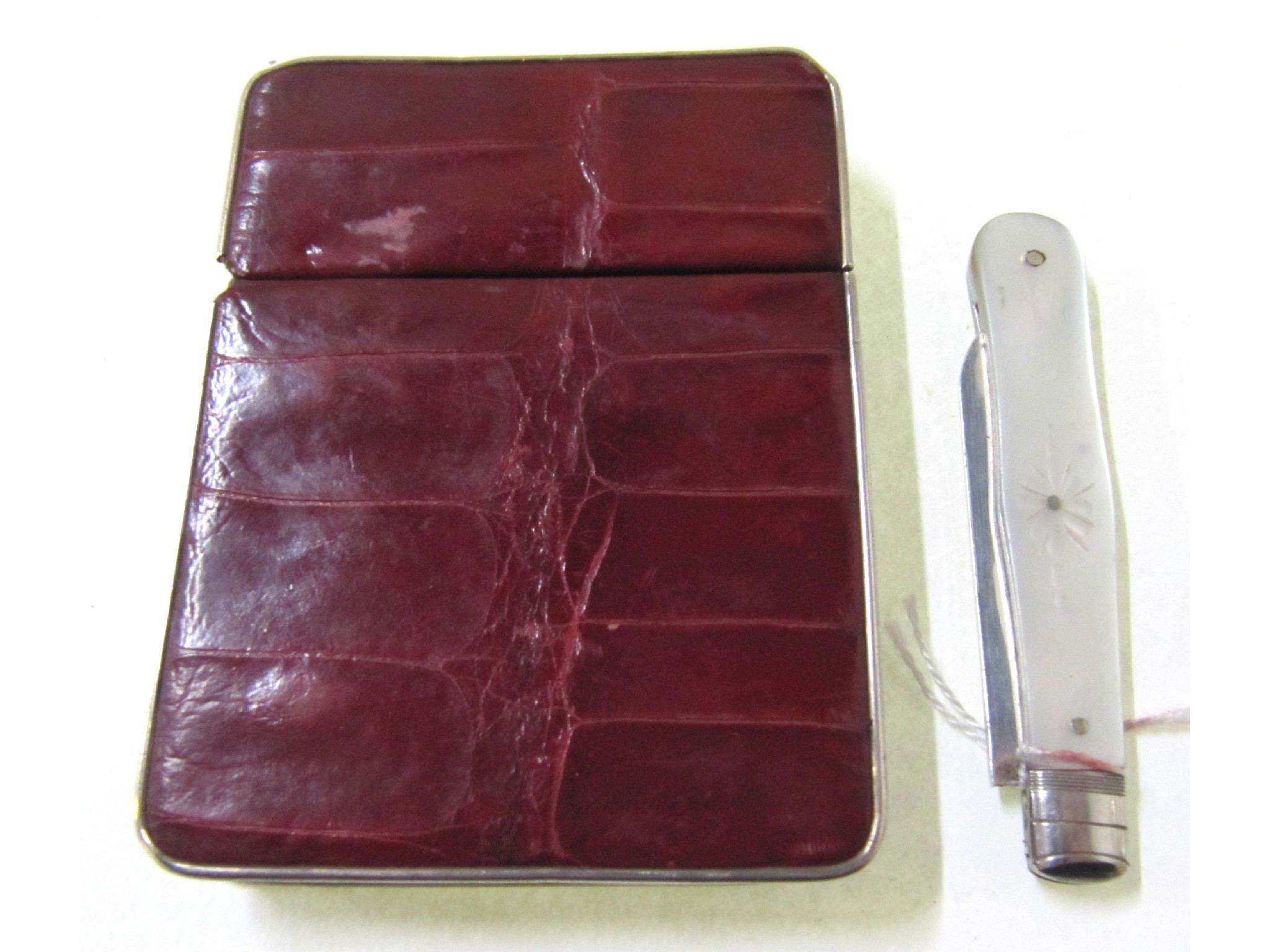 Appraisal: A lot comprising a leather card case and a silver