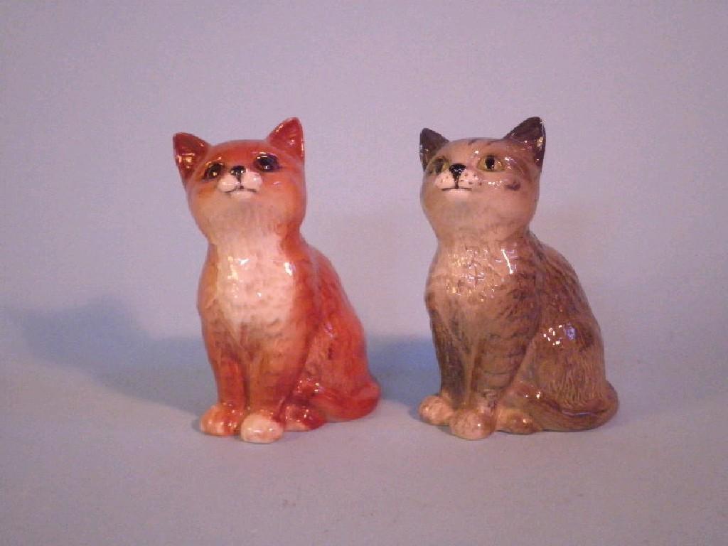 Appraisal: Beswick A Persian cat seated looking up ginger and a