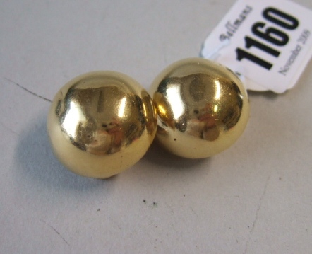 Appraisal: A pair of gold hemispherical plain earclips