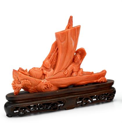 Appraisal: Chinese carved coral sampan modelSingle section of red to pink