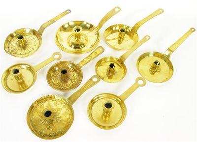 Appraisal: A pair of brass chambersticks with ring turned sconces one